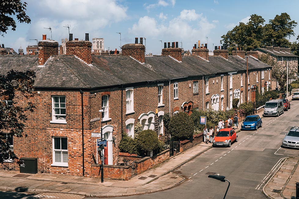 A row of Victorian brick terraces on a street in York, England, United Kingdom