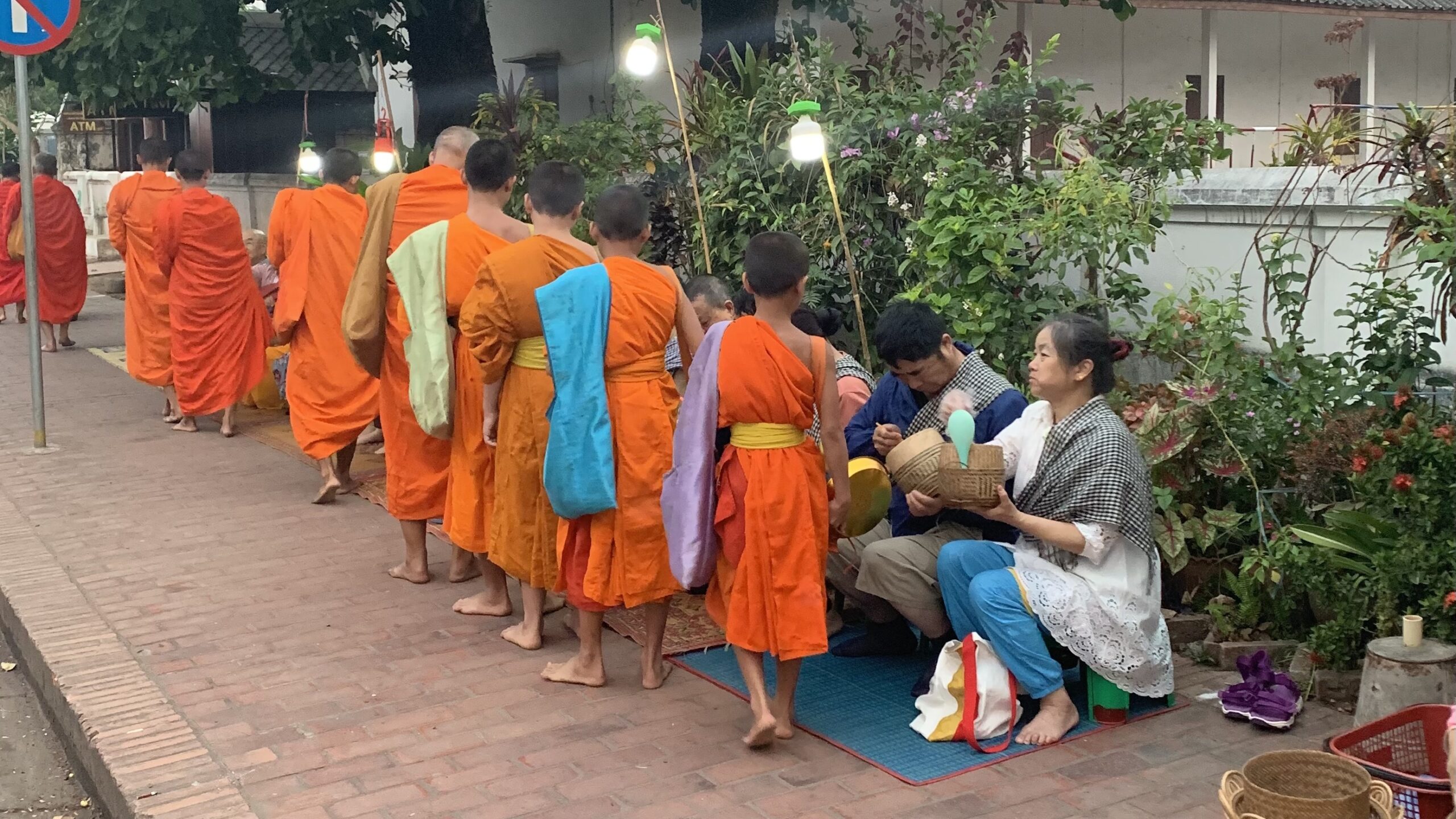 monk offerings in luang prabang laos