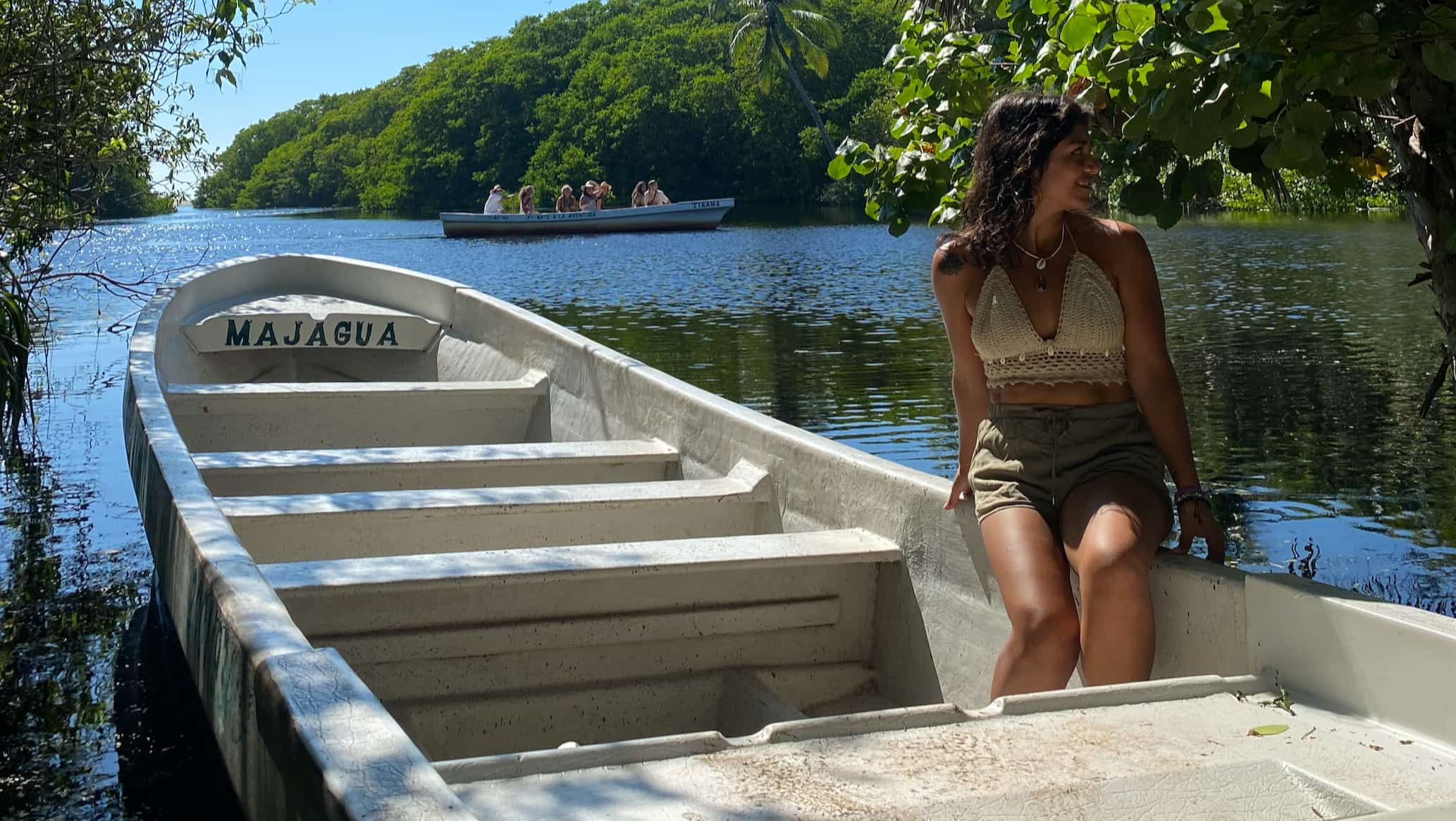  A girl sitting on a boat in a lake in Mexico