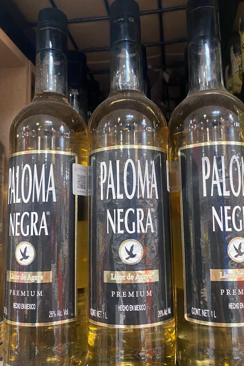 3 bottles of paloma negra, a liquor that is made in mexico