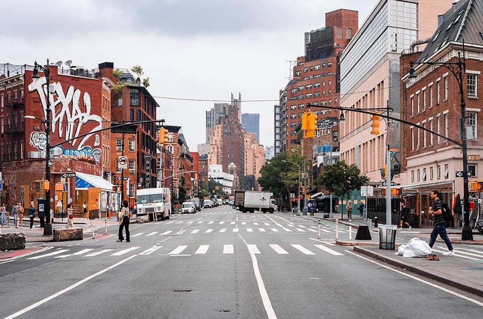 Looking down a wide street in Lower Manhattan, NYC, New York, USA United States of America.