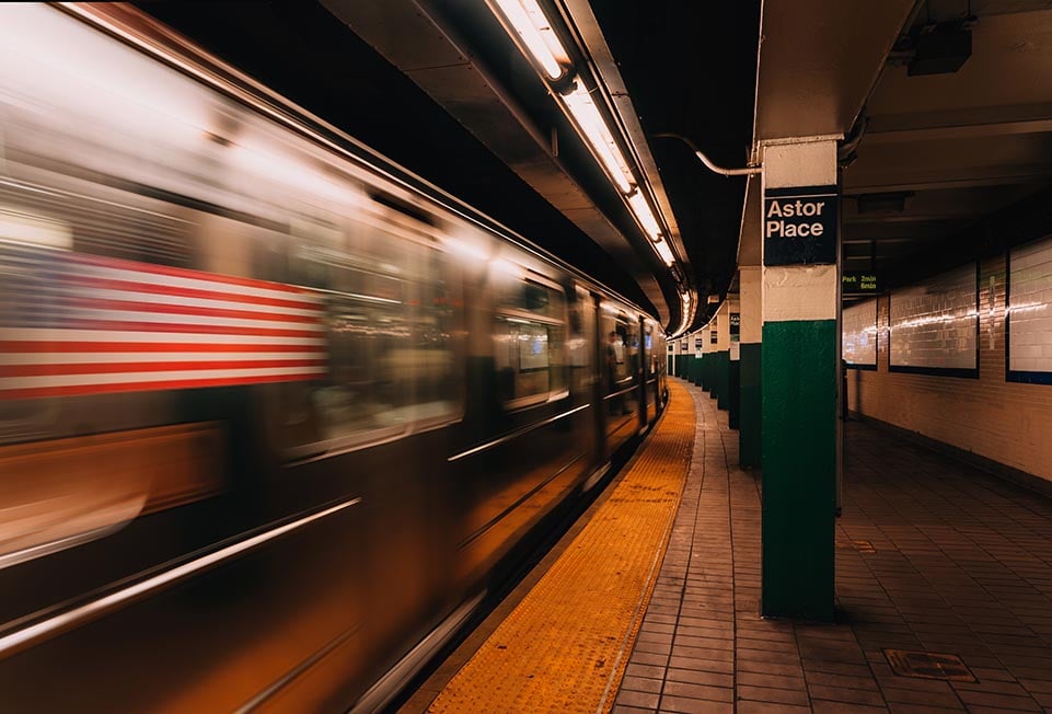 A subway train in NYC speeding through Astor place metro station. New York, USA. Long shutter speed photography.