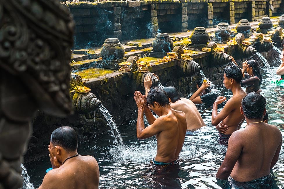 People praying at the water temple in Bali, Indonesia.