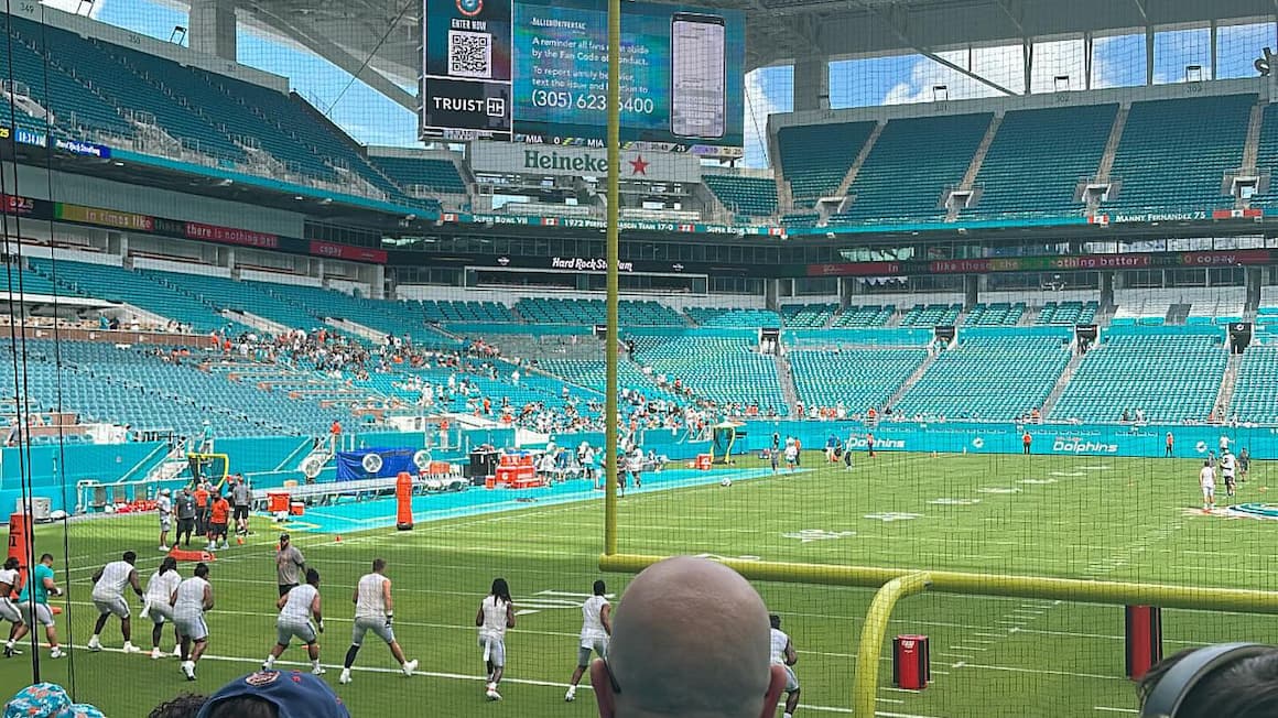 football players play a game of american football at the miami dolphin's stadium 