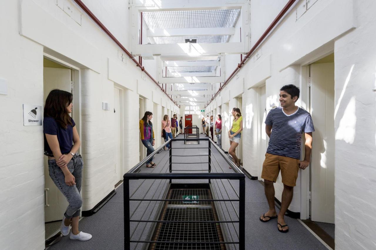 Guests standing outside their accommodations at YHA Fremantle Prison in Fremantle, WA, Australia