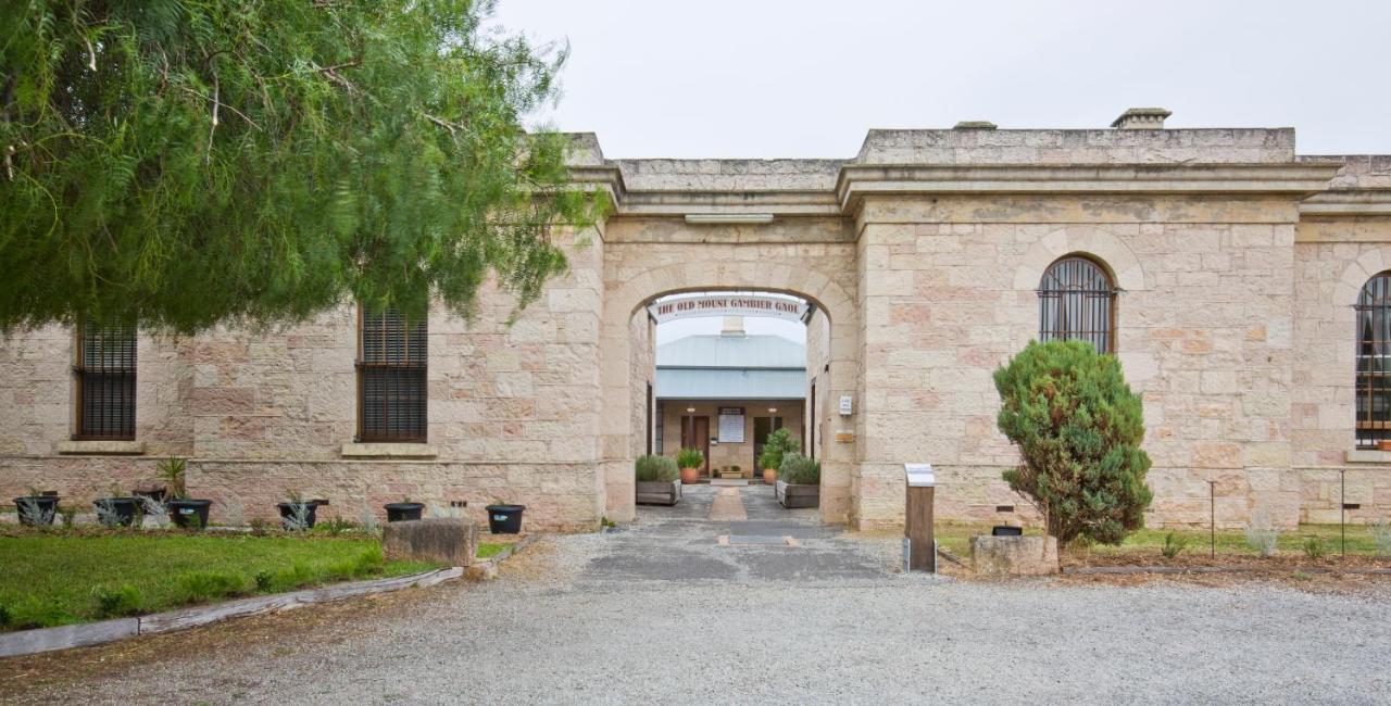 Stone facade of the Old Mount Gambier Gaol, featuring a grand arched doorway, located in Mount Gambier, Australia