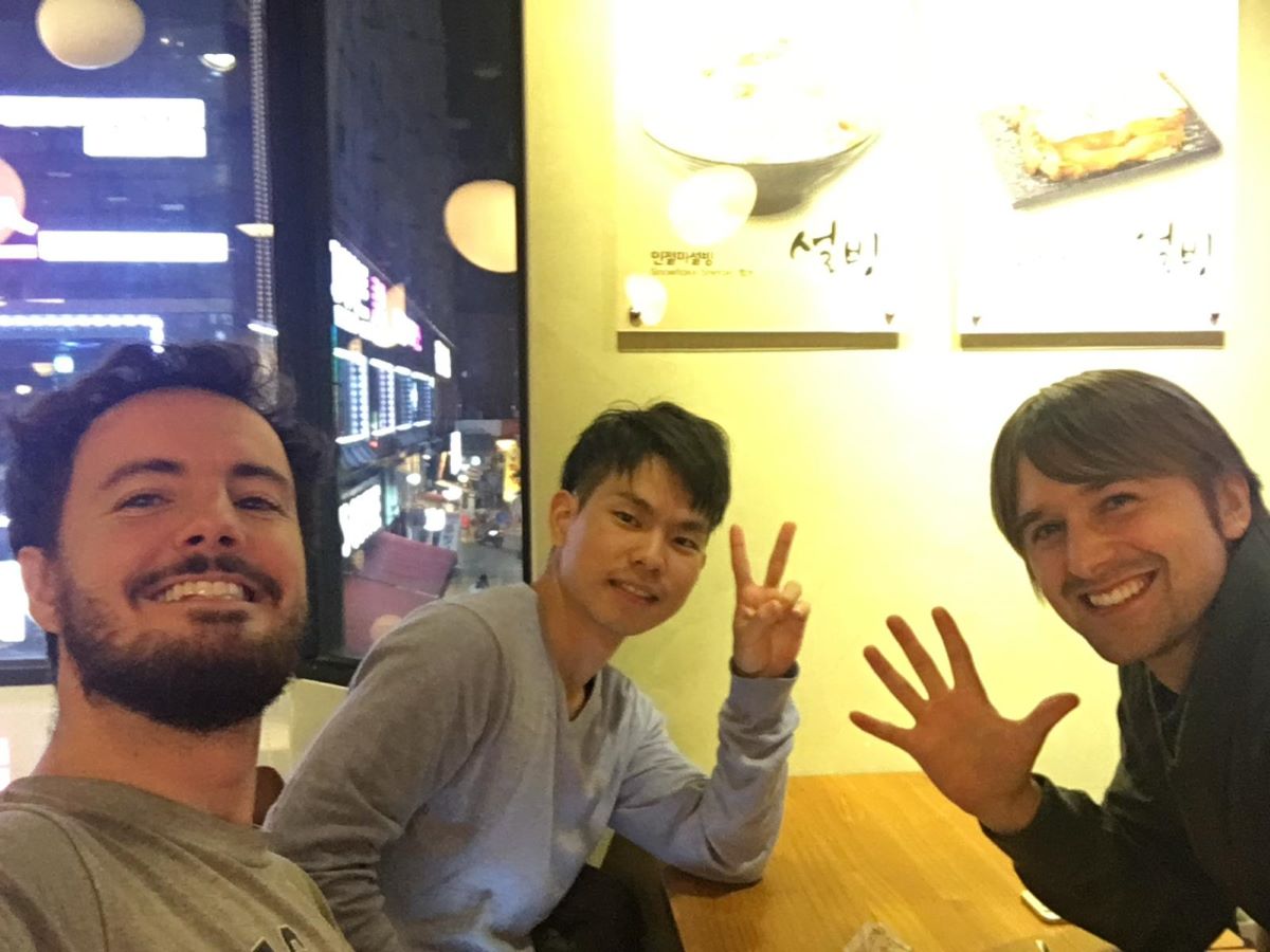 a tourist and two korean locals hanging out in south korea