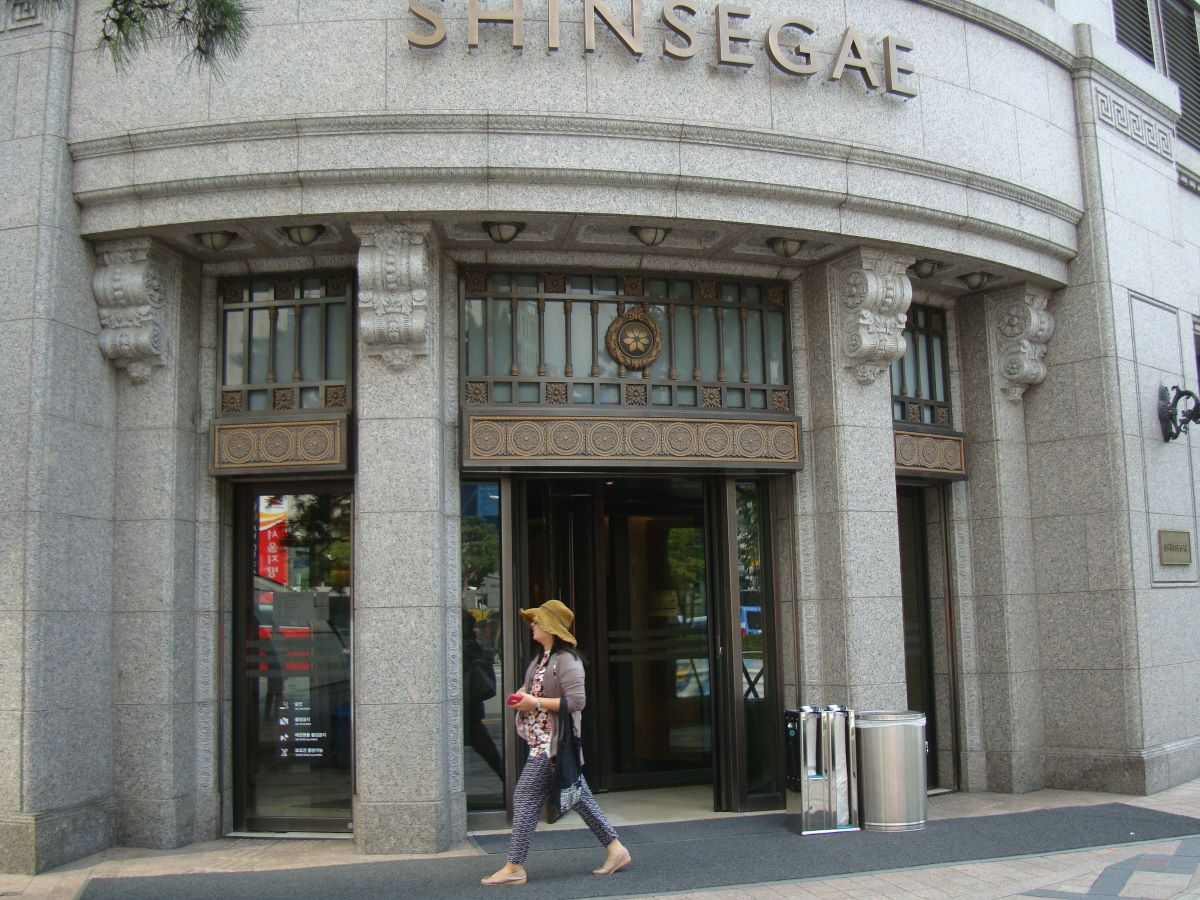 a woman walking in one of south korea's largest shopping complexes