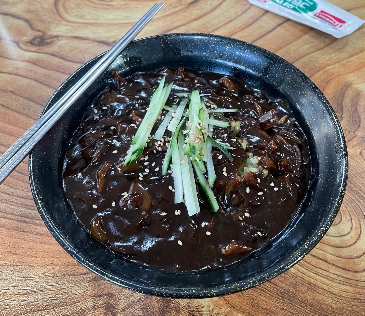 a popular south korean food in a black bowl