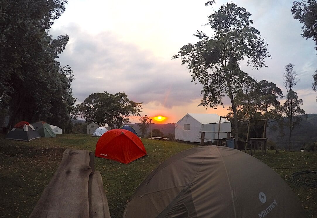 Camping area with tents around in Colombia during sunset hour.