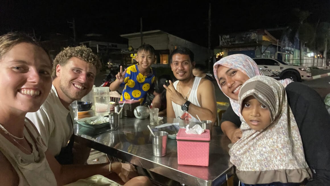 dani and harvey out for dinner in thailand with thai friends