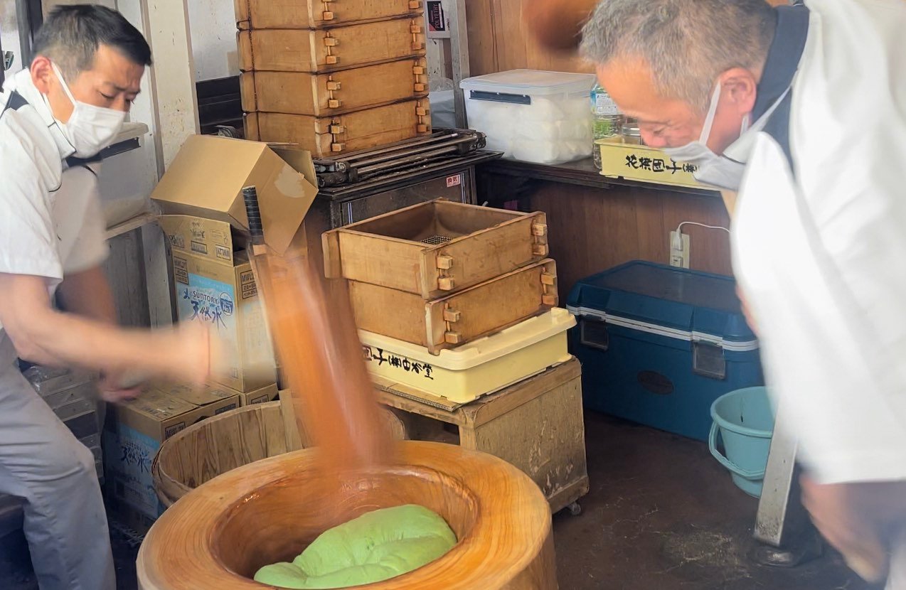 Two guys making matcha in Nara Park, Japan.