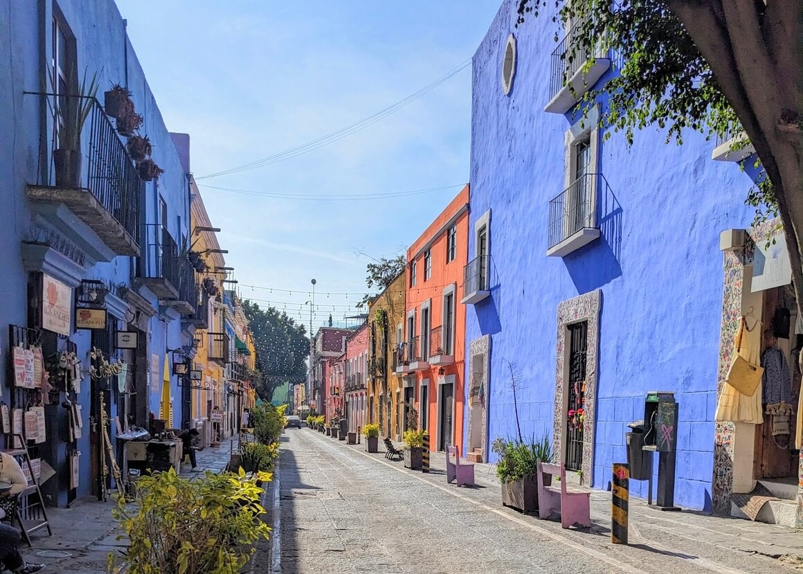 Colourfully painted buildings on a stone street