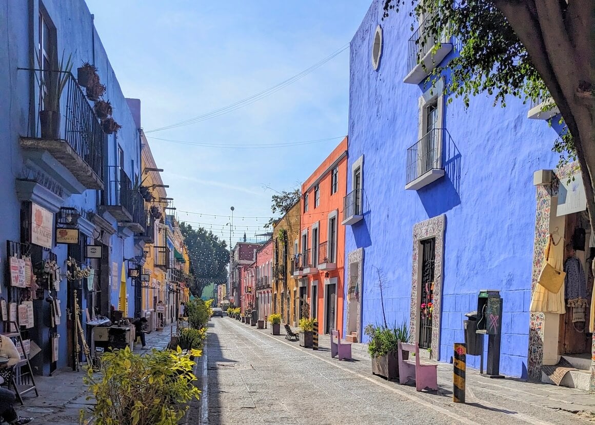 Colourfully painted buildings on a stone street