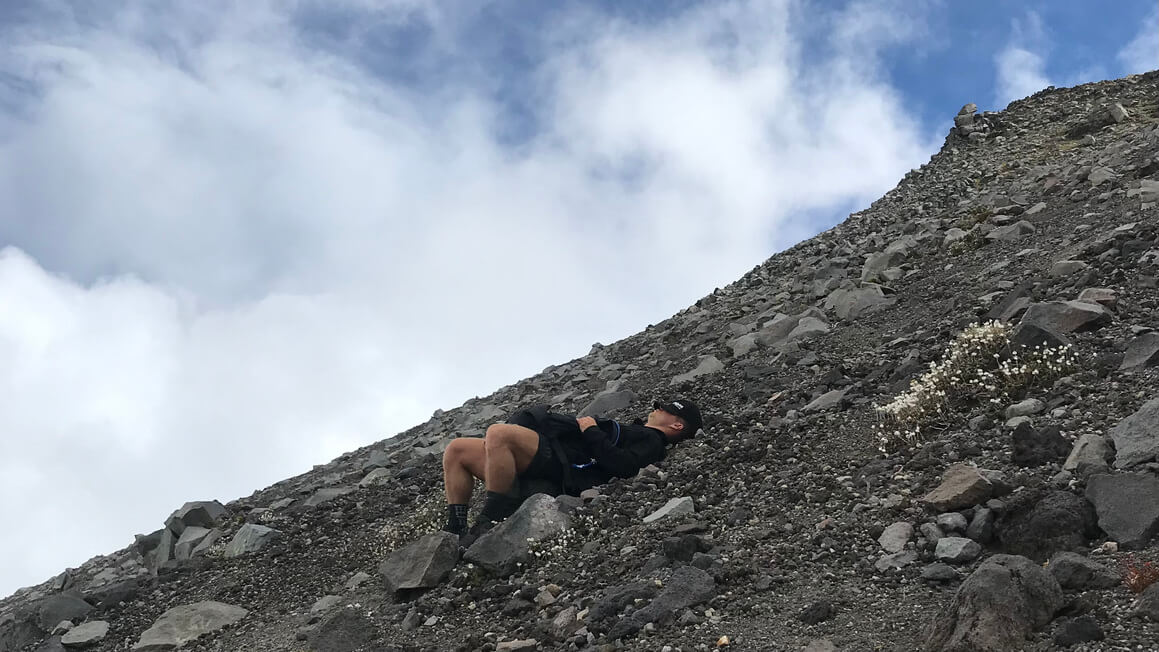 resting up when hiking mount egmont, takanaki, new zealand