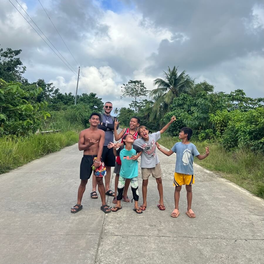 Joe with local kids in Siargao, Philippines 
