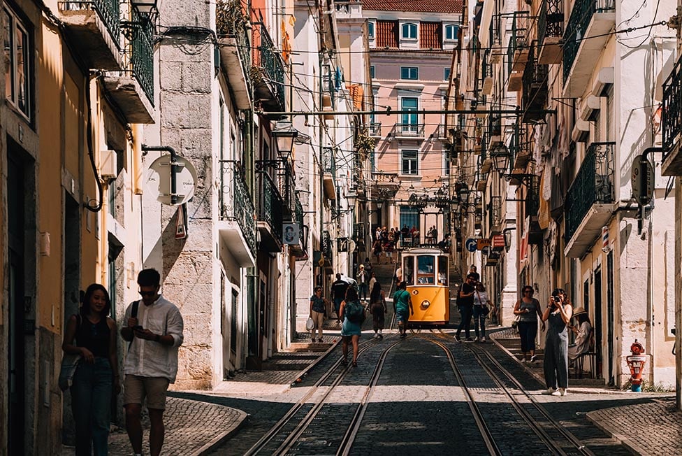 The Bica funicular making it's way up a steep narrow street in Lisbon, Portugal.