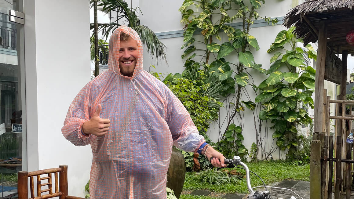 guy with a rain jacket on in south east asia