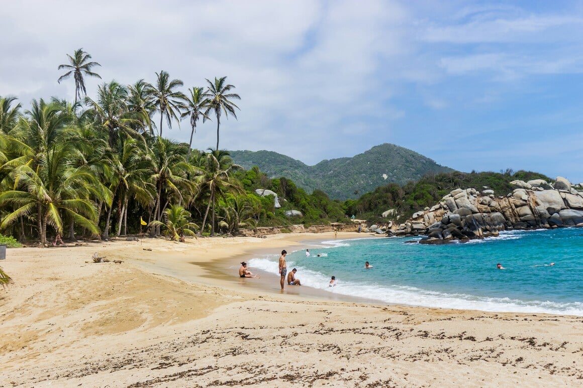 People at the beach in Tayrona Natural National Park in Colombia.  