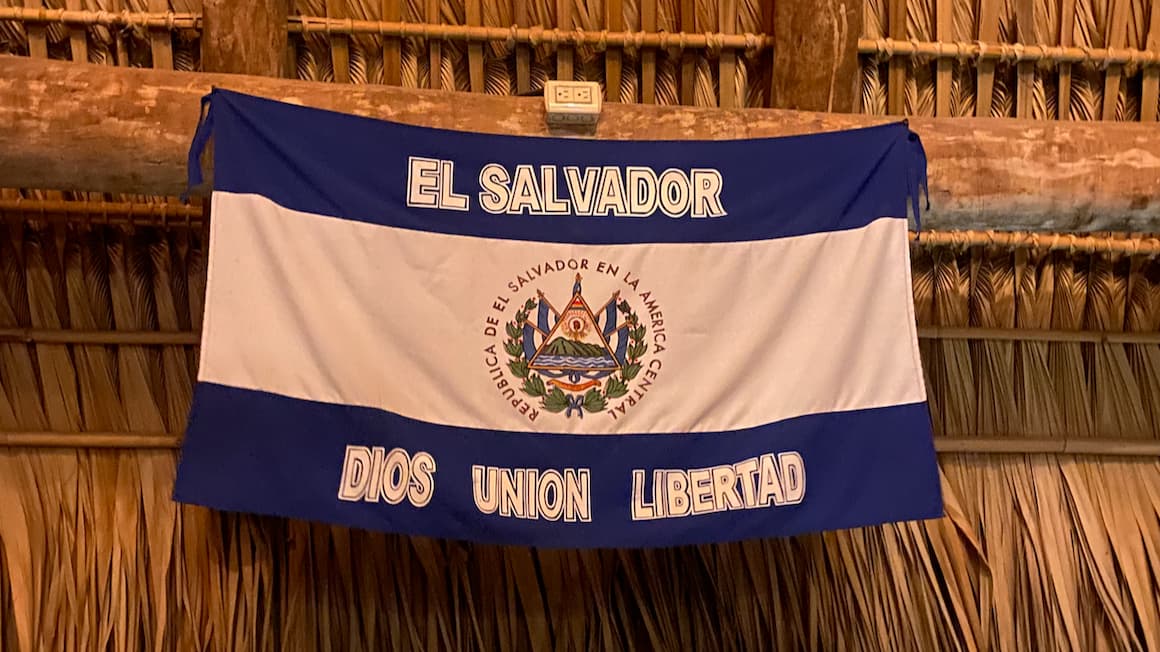 the striped blue and white el Salvador flag hanging at a restaurant