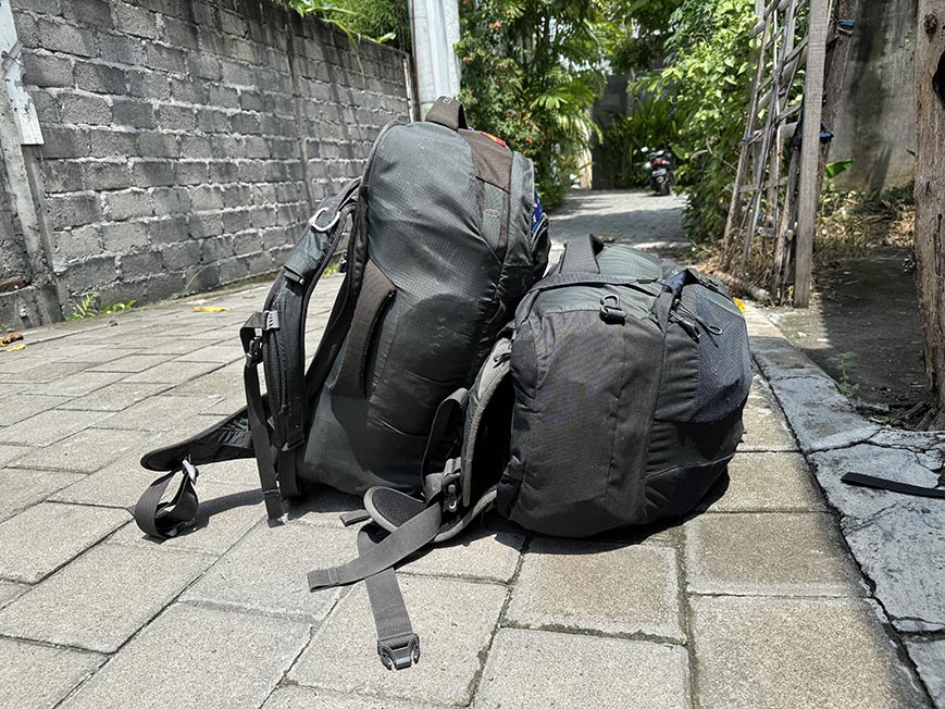 A pile of backpacks waiting to be picked up.