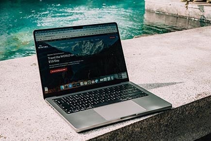 A laptop by the pool.