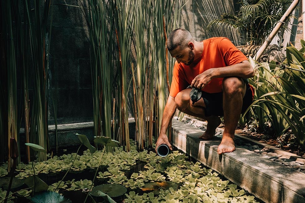 Joe using the Grayll Geopress in a pond filled with dirty water.