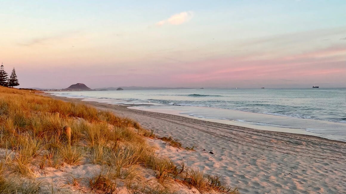 papamoa beach in new zealand at sunset, looking toward mount maunganui, Tauranga, New Zealand