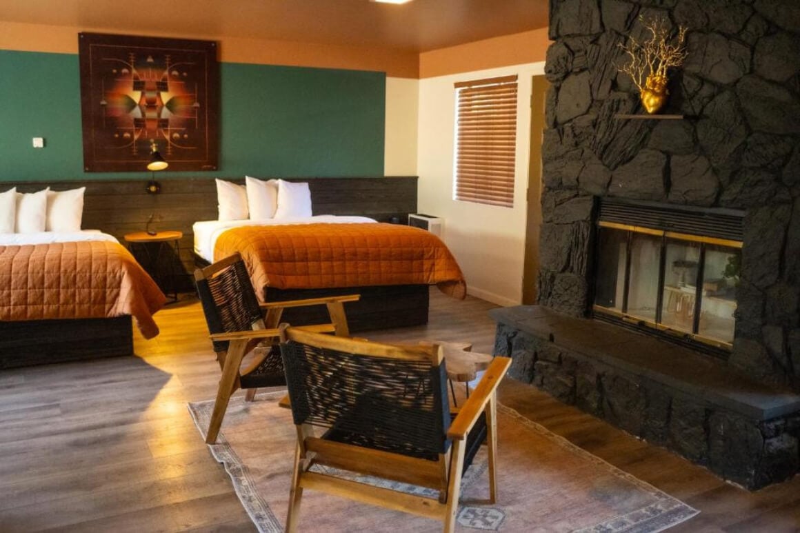 Cozy family room at Sessions Retreat & Hotel, Big Bear CA. Indoor fireplace and cute warm decor