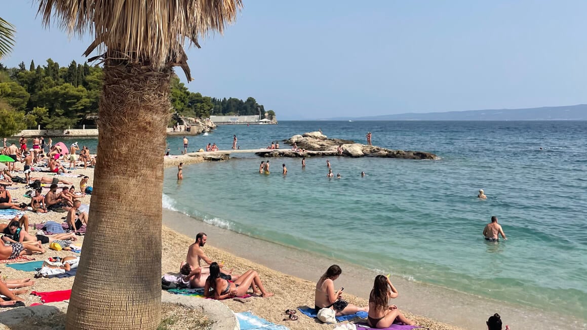 busy beach in split croatia on a sunny day 