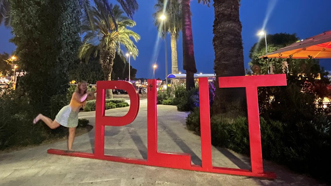 Split sign in split, croatia. Missing the S so girl is pretending to be the S