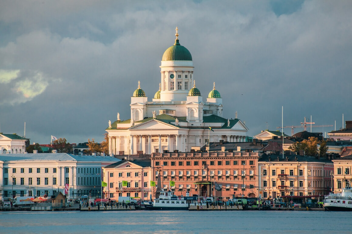 helsinki cathedral towering over other buildings on the coastline, helsinki