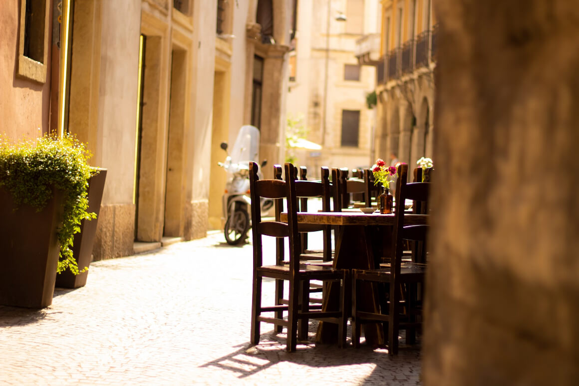 A table down a quiet side street in Verona, Italy