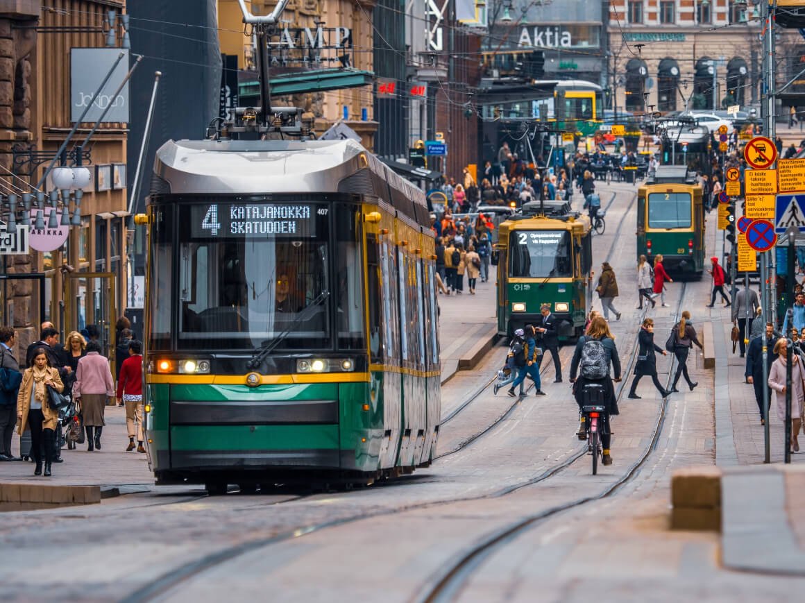 trams on a busy street in Helsinki's city centre