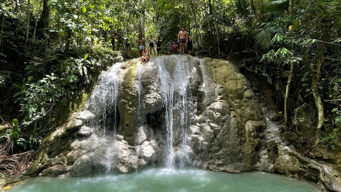 Dani and Harv about to jump off Lugnason Falls, waterfall in Siquijor, Philippines