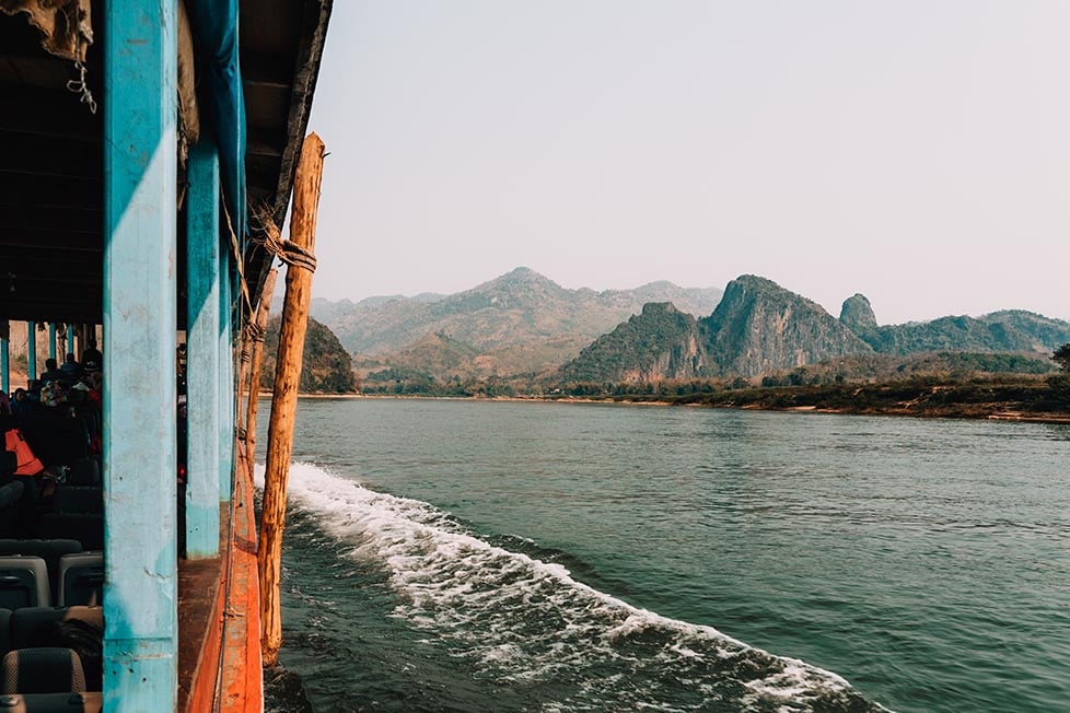 Mountains in the distance from a boat along the river in Laos