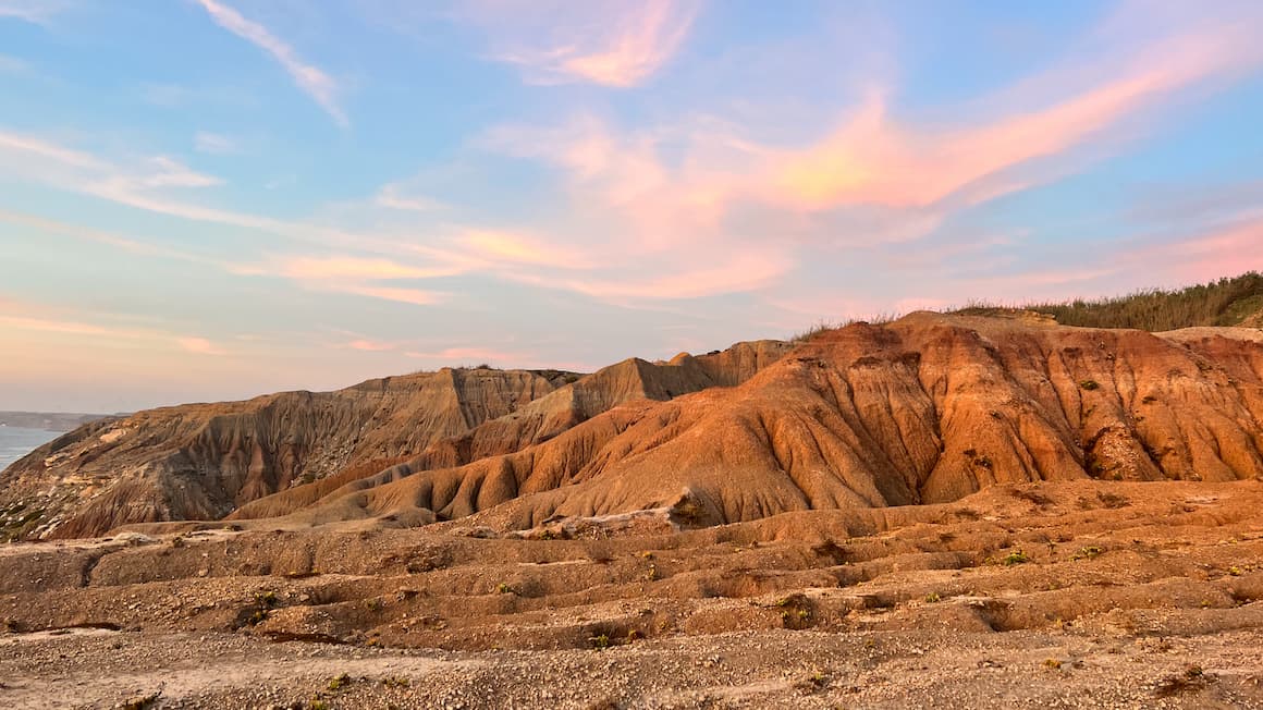 a sunset over a canyon in utah, united states 