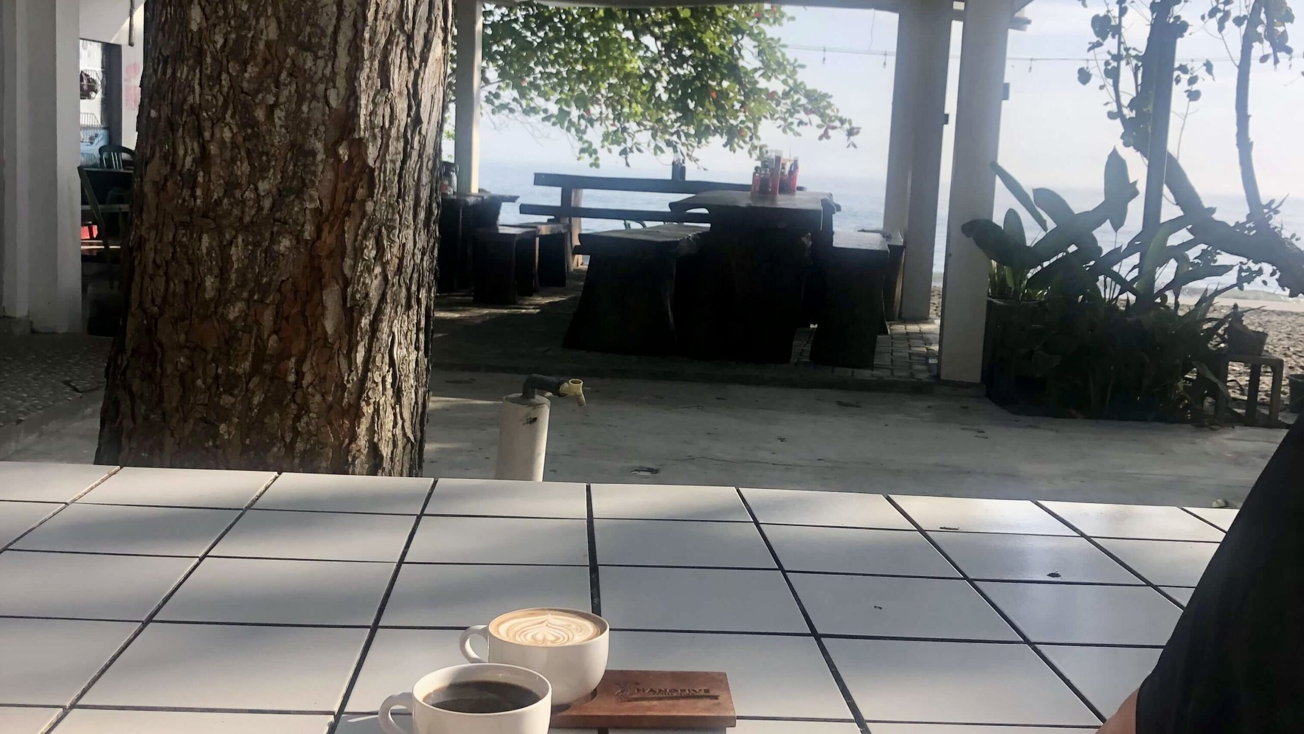 Morning coffee watching the surf in Java, Indonesia