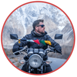 photo of Will Hatton on a motorbike, founder of The Broke Backpacker site