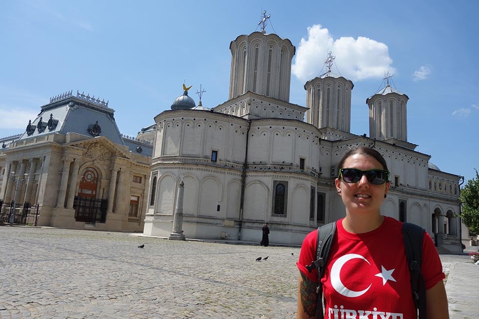 Nic standing in front of an ornate old orthodox church in Bucharest, Romania