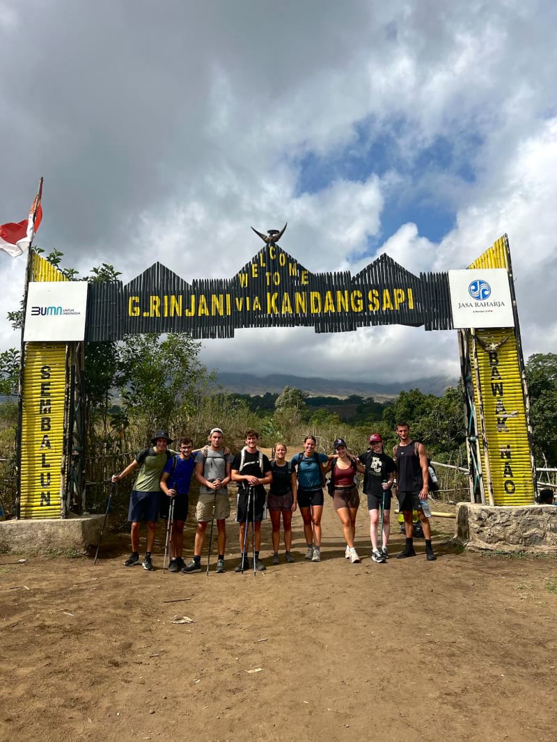 a group of nine hikers at the start of the mount rinjani hike in sambalun village on lombok