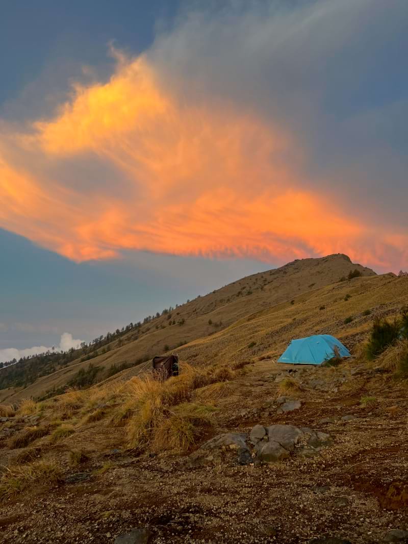 an epic orange and pink cloud sunset on mount rinjani campsite day 2