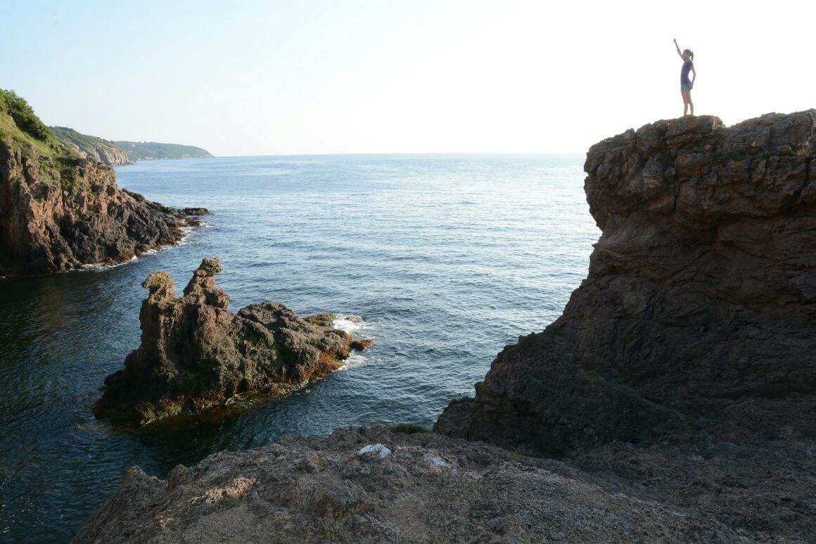 denmark bornholm traveler at coast cliff