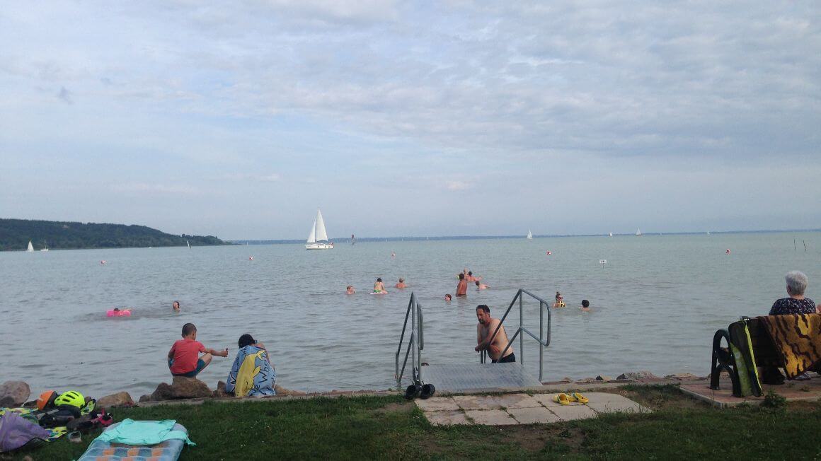 people swimming in lake balaton in hungary