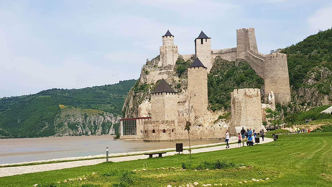 green lush forested landscapes and the Golubac Fortress