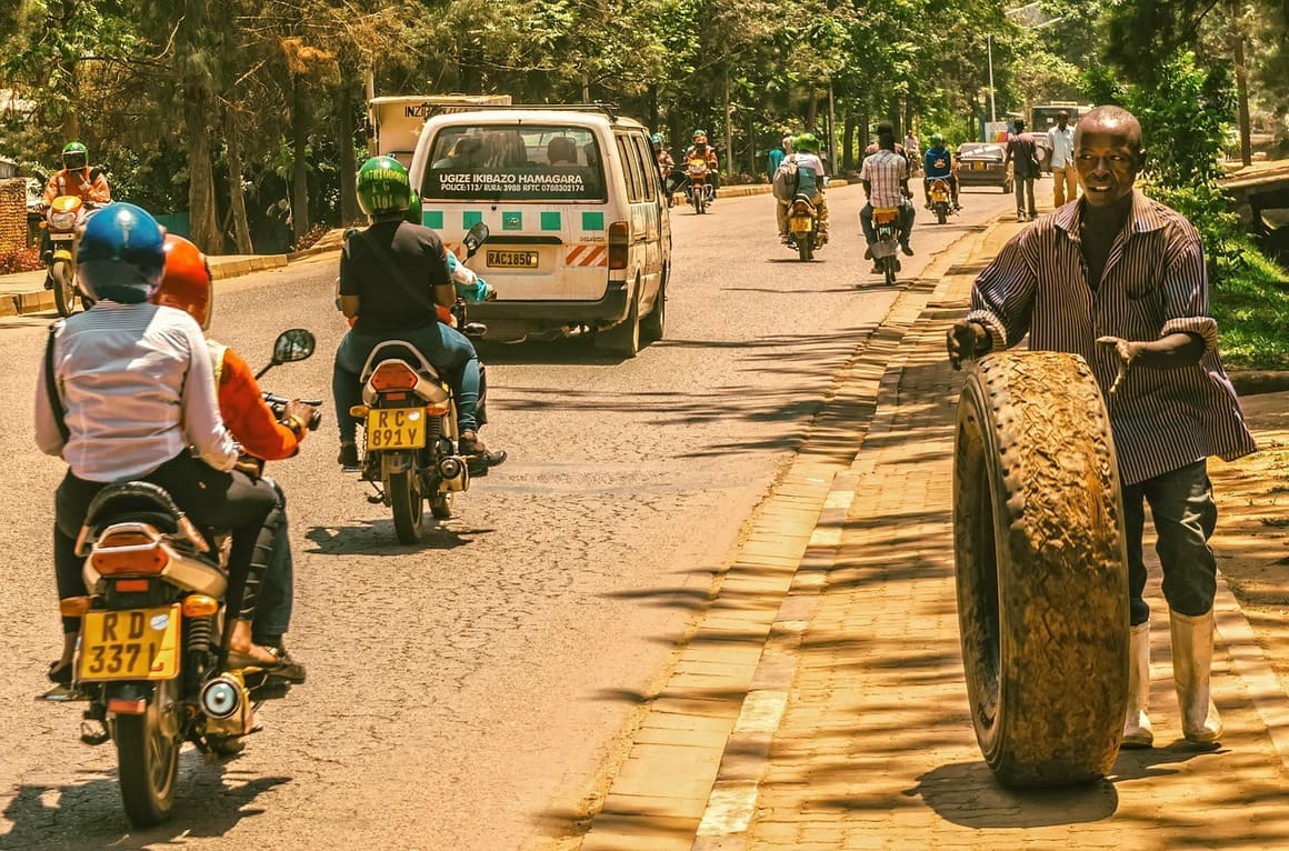 vehicles driving down road in kigali