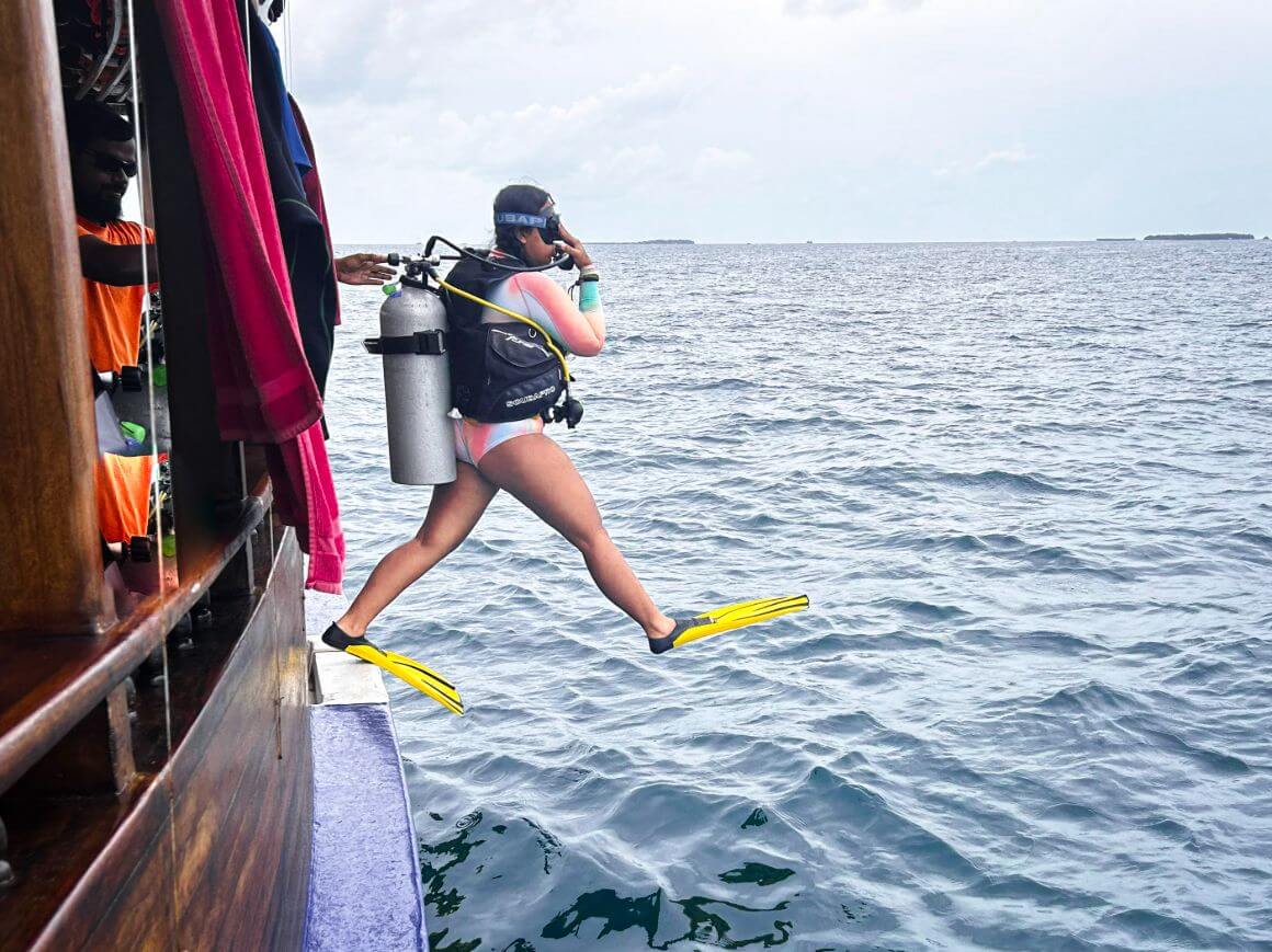 scuba diver jumping down rasdhoo sea