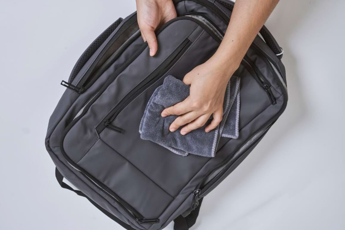 cleaning backpack with washcloth