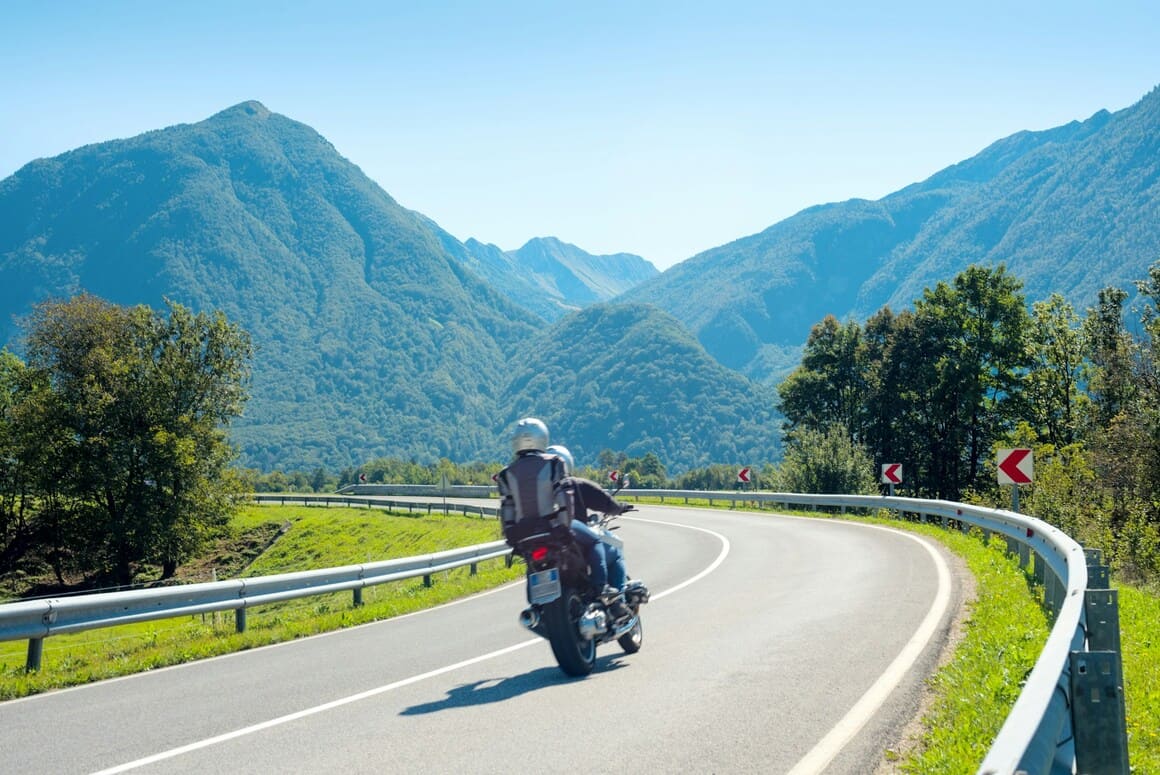 couple riding motorbike slovenia