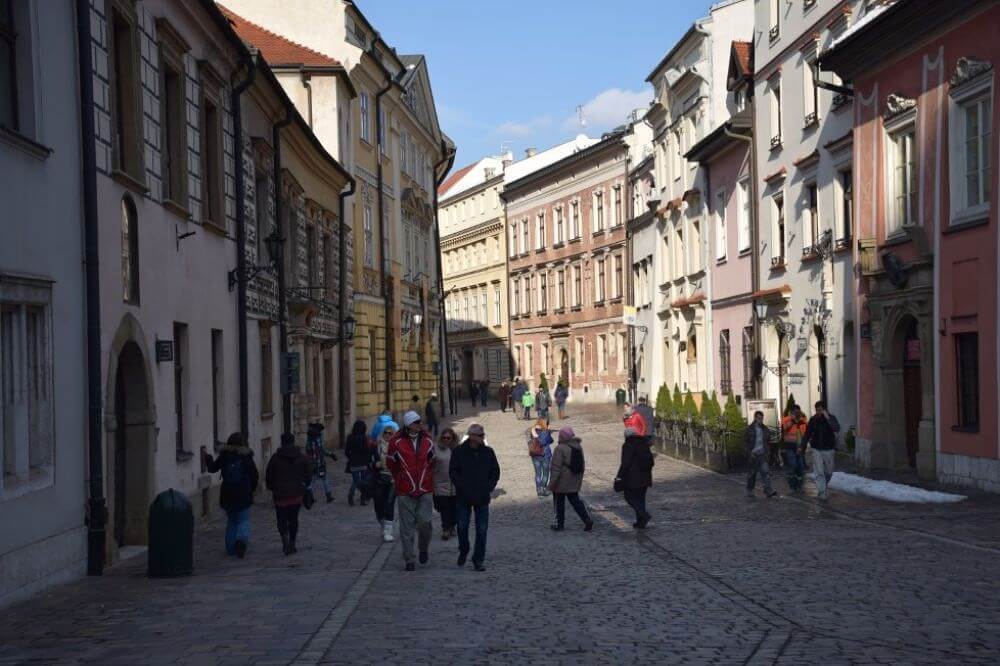 people walking along the Cobbled streets of Krakow poland